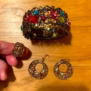 Custom jewelry bangle, ring and earring set in rainbow jewels.